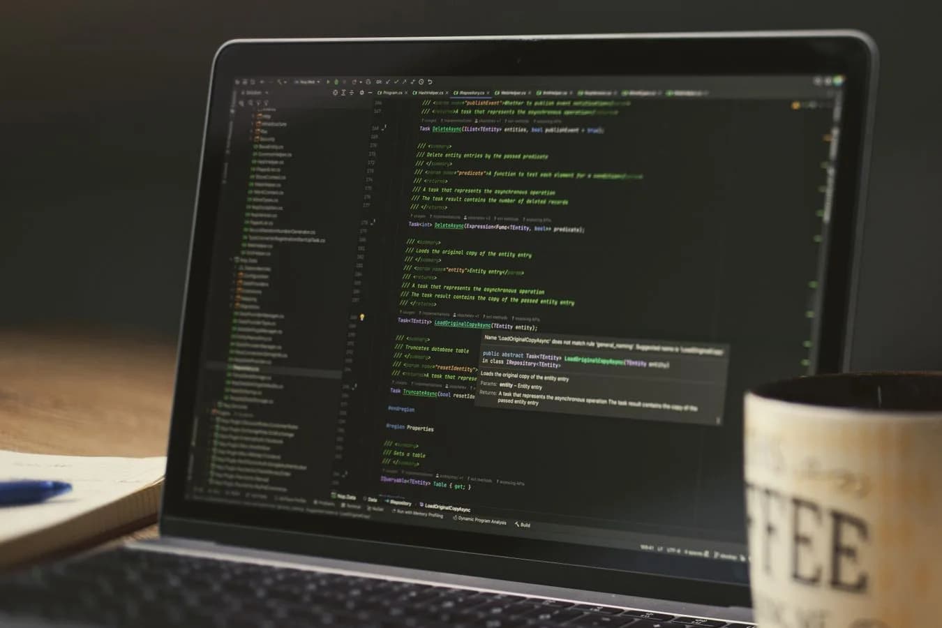 Developer working late to build a Base app, laptop and coffee on the desk. Photo by Daniil Komov on Pexels.