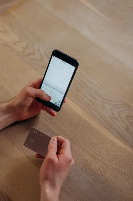Close-up of a smartphone showing a mobile trading and wallet app, representing how Robinhood Chain stock tokens sit in a self-custody wallet. Photo by Mikhail Nilov on Pexels.