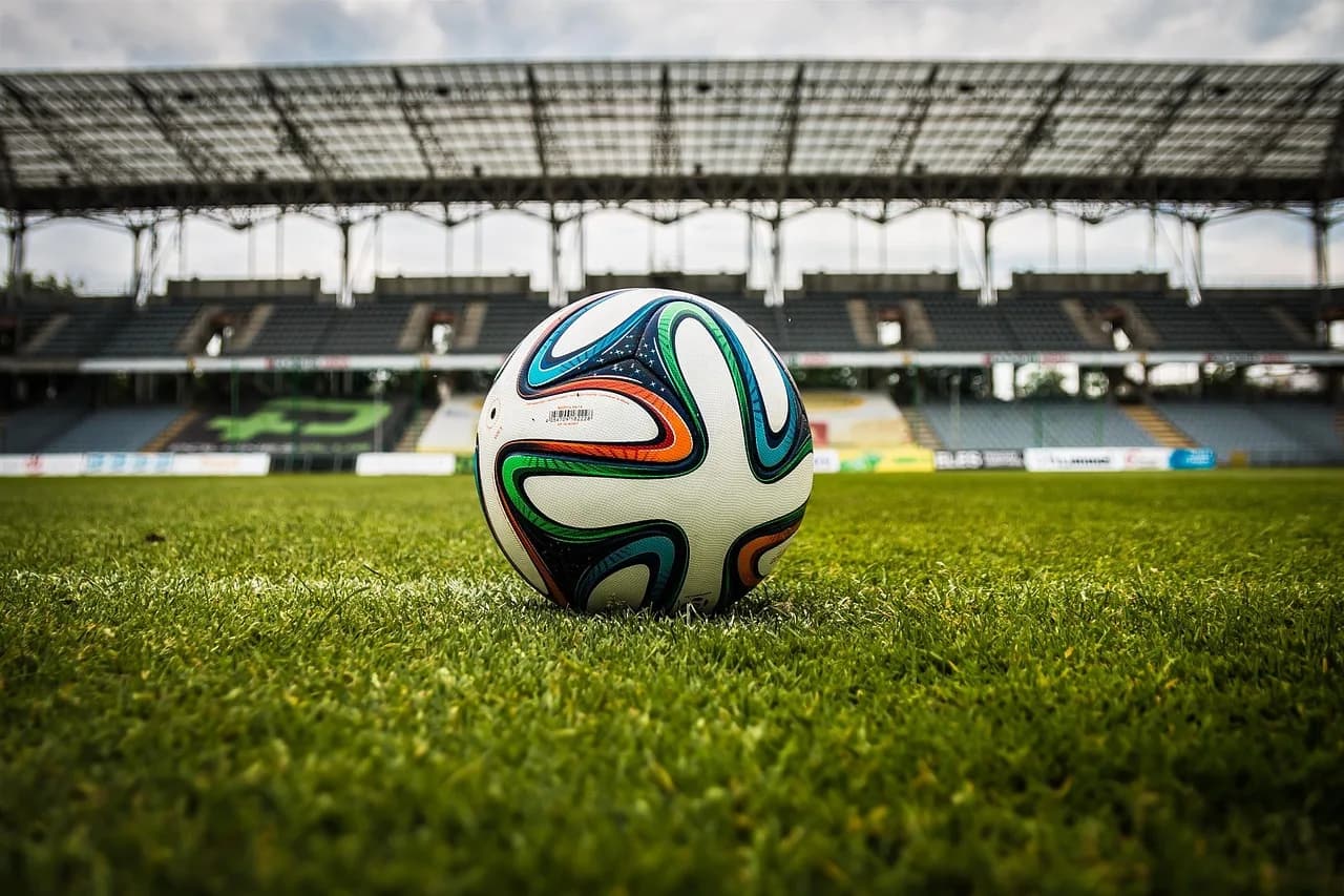 Soccer ball on a stadium field representing the World Cup matches driving Polymarket's record trading volume