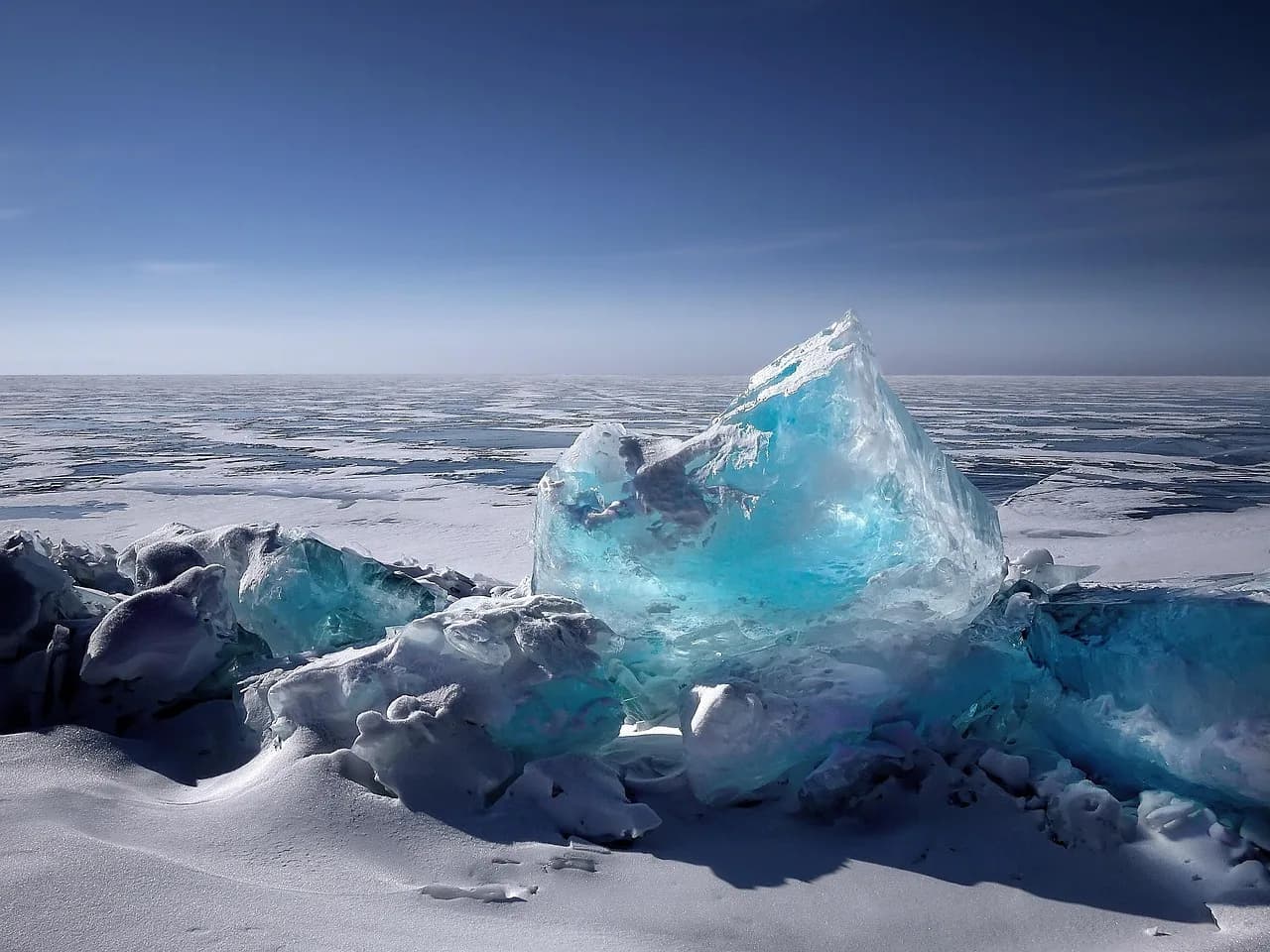 Iceberg floating in cold water representing frozen crypto assets