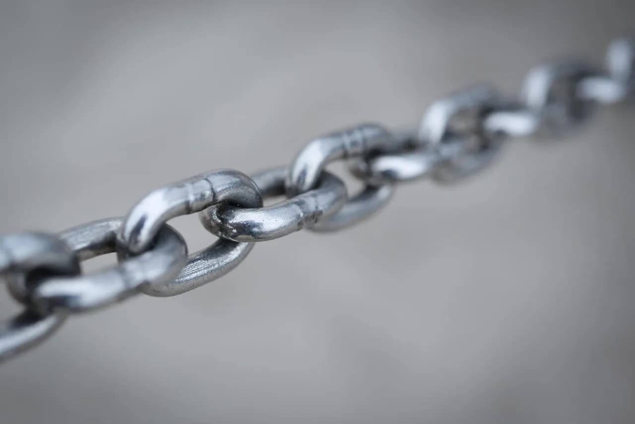A strong steel chain, representing the smart contract link you trust every time you bridge to Base