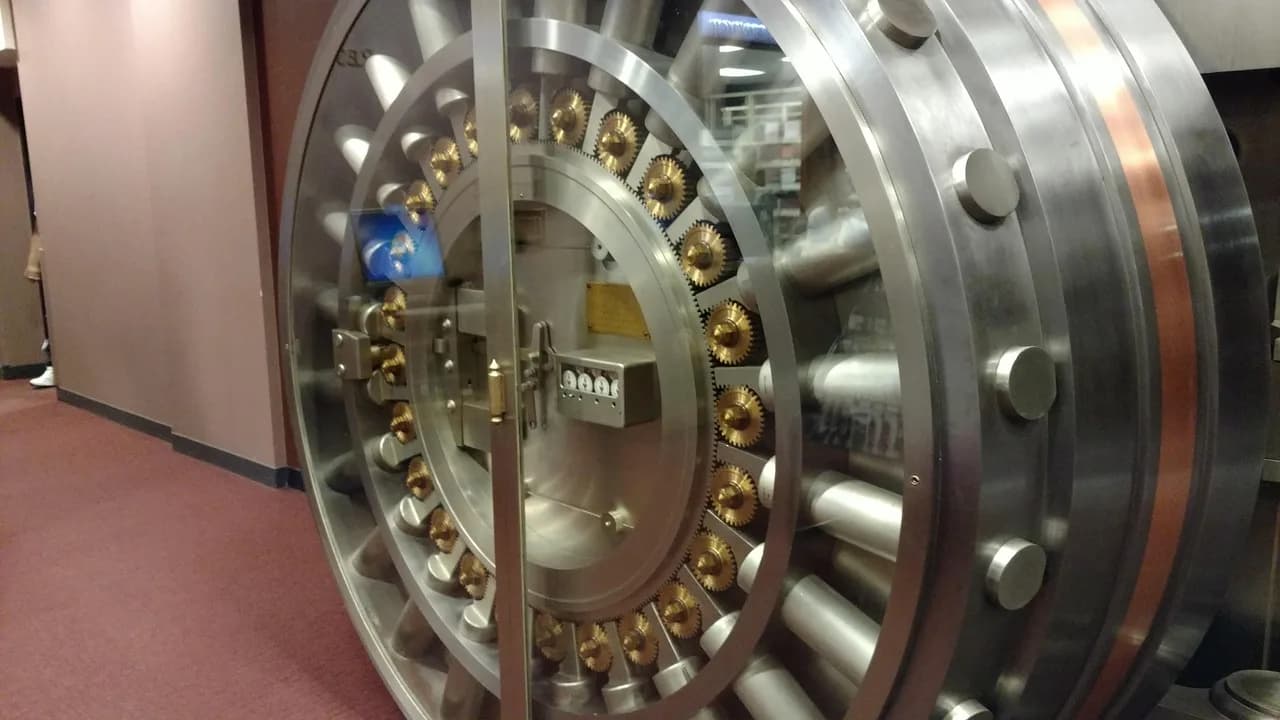 A bank vault door, representing the security and custody standards the GENIUS Act stablecoin rules require of issuers