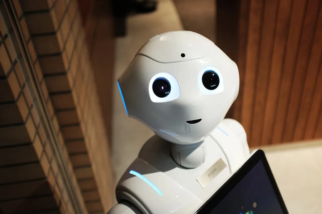 A white robot, representing the automated agent this build creates. Photo by StockSnap on Pixabay.