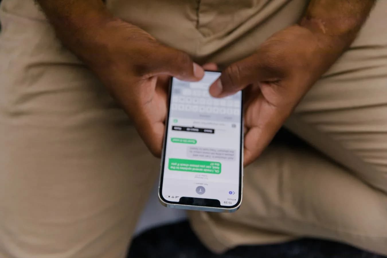 Close-up of hands texting on a smartphone, representing reaching a self-hosted AI agent remotely. Photo by RDNE Stock project on Pexels.