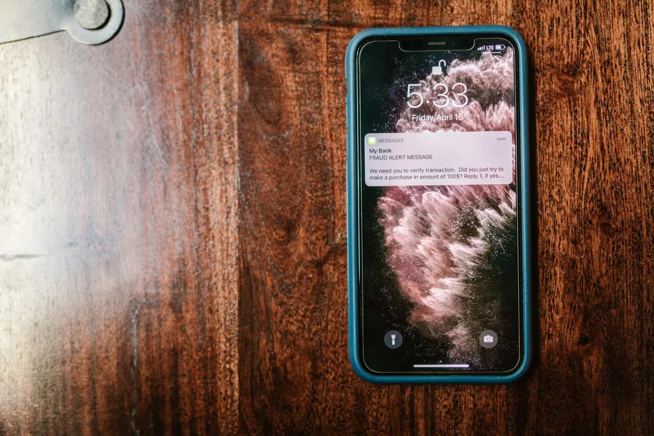 Close-up of a smartphone displaying a fraud alert message, the kind of notification this monitor is built to send. Photo by RDNE Stock project on Pexels.