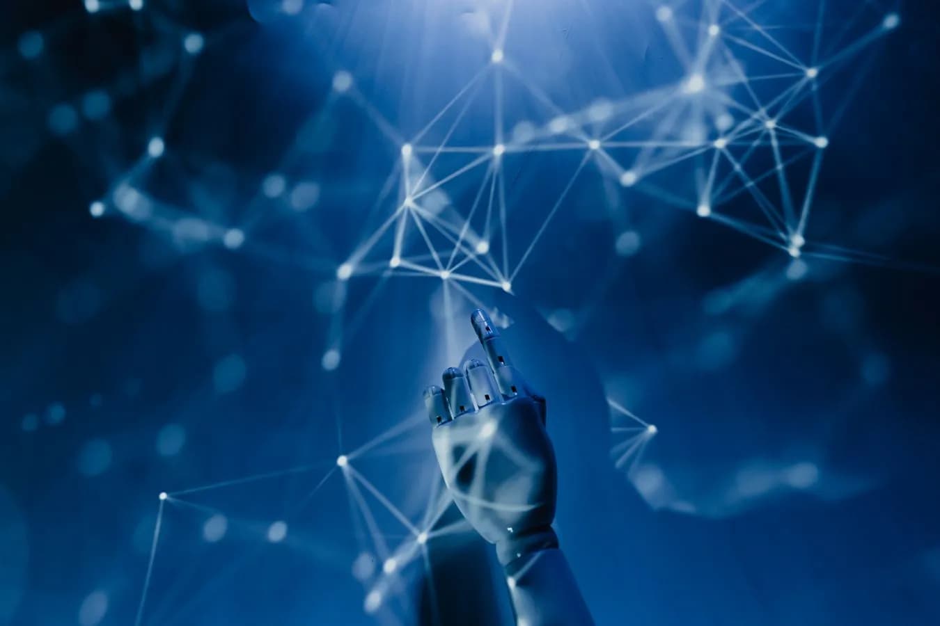 Robotic hand reaching toward a glowing digital network, representing an AI agent connecting to onchain tools. Photo by Tara Winstead on Pexels.